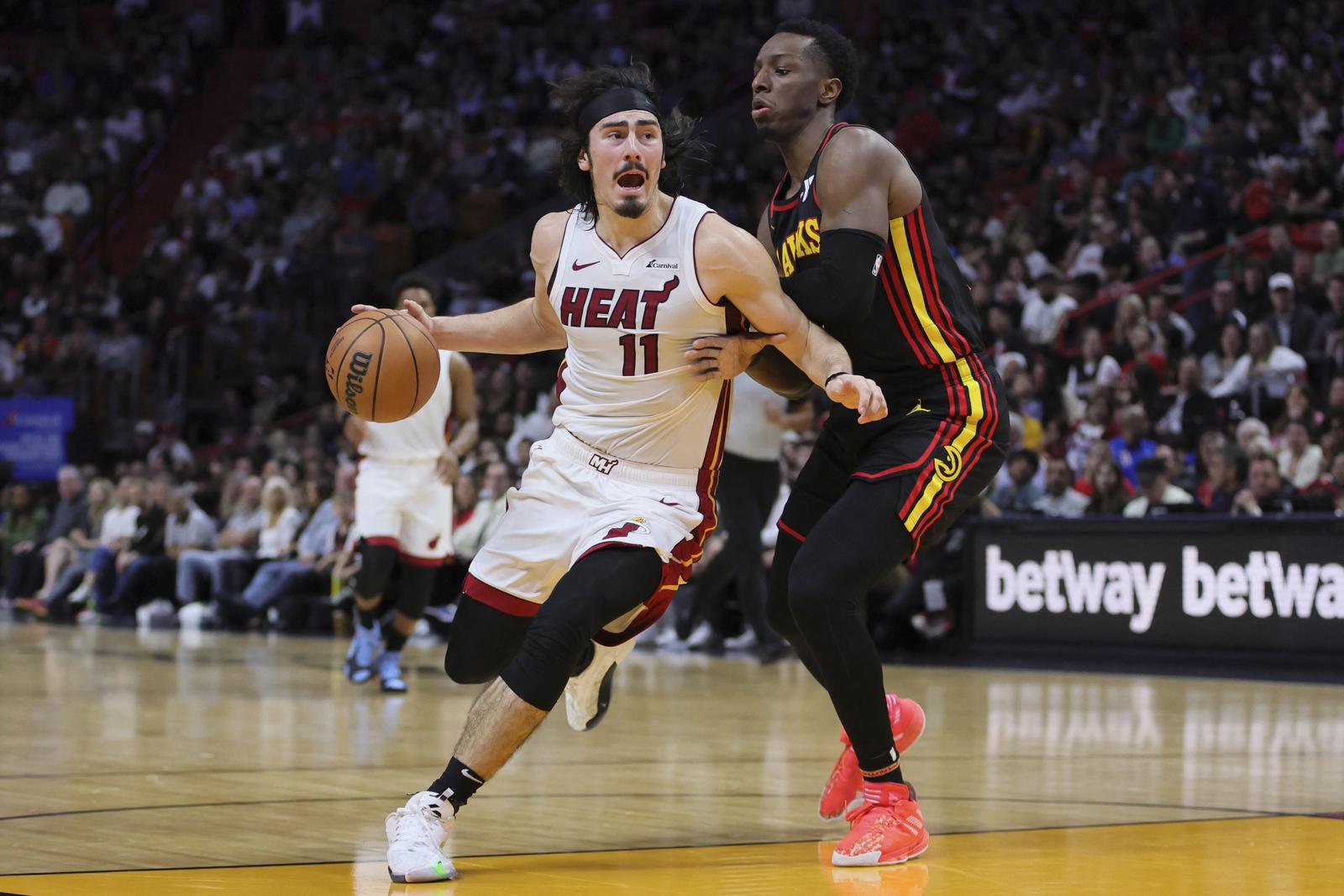Dec 22, 2023; Miami, Florida, USA; Miami Heat guard Jaime Jaquez Jr. (11) drives to the basket against Atlanta Hawks forward Onyeka Okongwu (17) during the third quarter at Kaseya Center. Mandatory Credit: Sam Navarro-USA TODAY Sports Photo: Sam Navarro/REUTERS