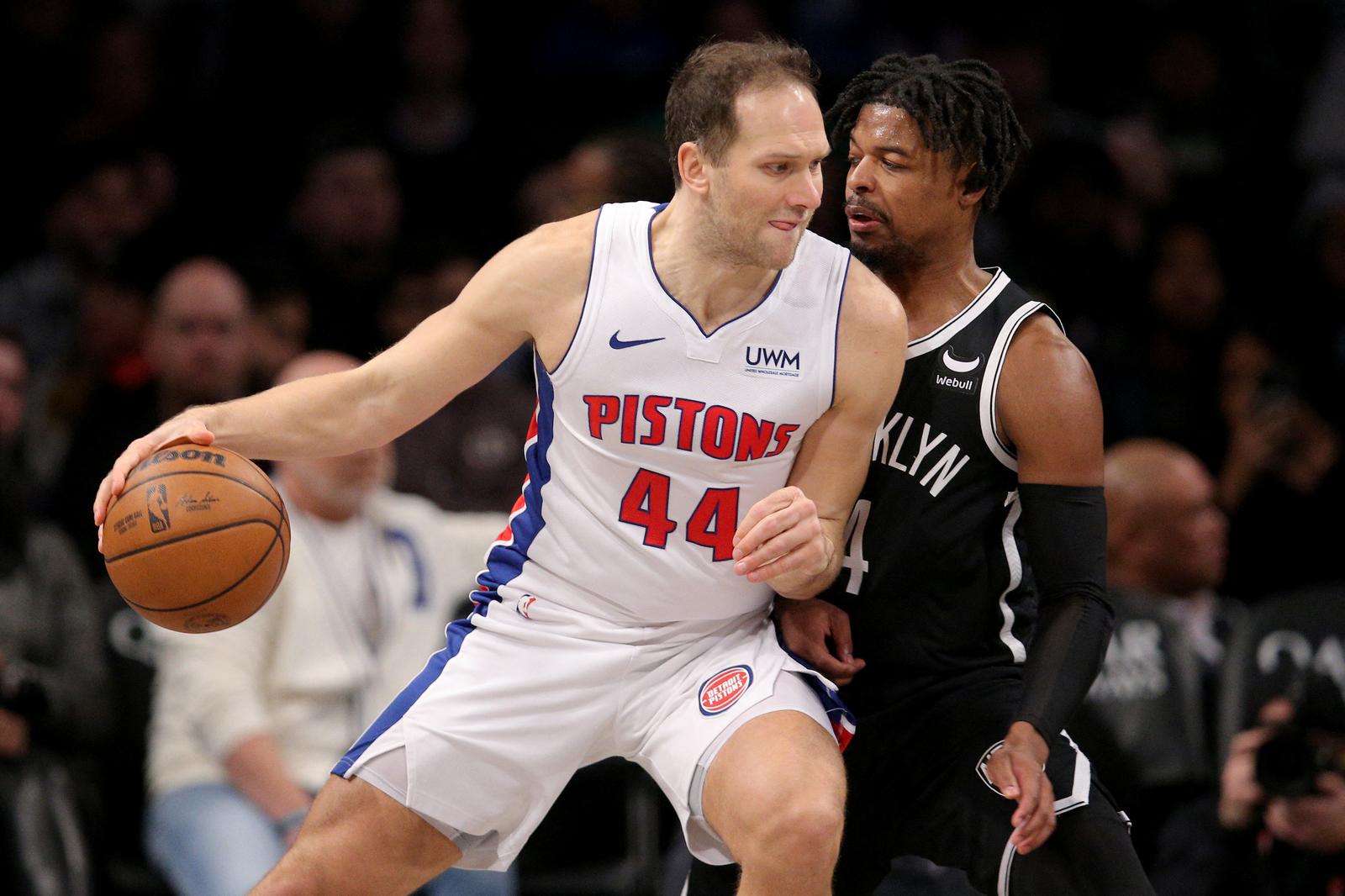 Dec 23, 2023; Brooklyn, New York, USA; Detroit Pistons forward Bojan Bogdanovic (44) controls the ball against Brooklyn Nets guard Dennis Smith Jr. (4) during the second quarter at Barclays Center. Mandatory Credit: Brad Penner-USA TODAY Sports Photo: Brad Penner/REUTERS
