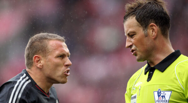 Liverpool's Craig Bellamy, left, reacts to referee Mark Clattenburg during their English Premier League soccer match at the Britannia stadium, Stoke, England. Saturday, Sept. 10, 2011. (AP Photo/Simon Dawson)