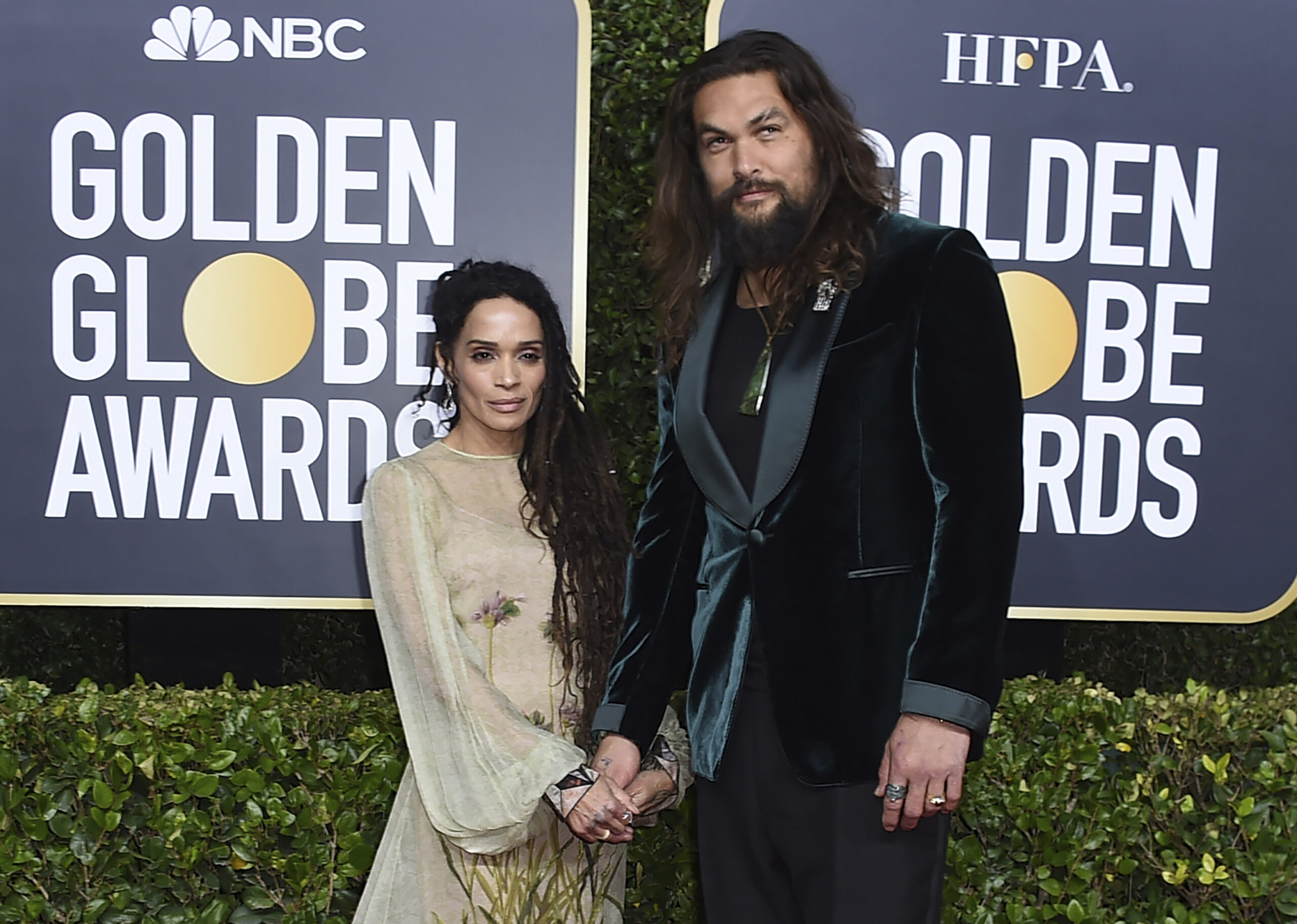FILE - Lisa Bonet, left, and Jason Momoa arrive at the 77th annual Golden Globe Awards at the Beverly Hilton Hotel on Sunday, Jan. 5, 2020, in Beverly Hills, Calif. The couple  have ended their 16-year relationship. A joint statement posted on the “Aquaman” star’s Instagram page Wednesday, Jan. 12, 2022, said that Momoa and his wife were parting ways. (Photo by Jordan Strauss/Invision/AP, file)