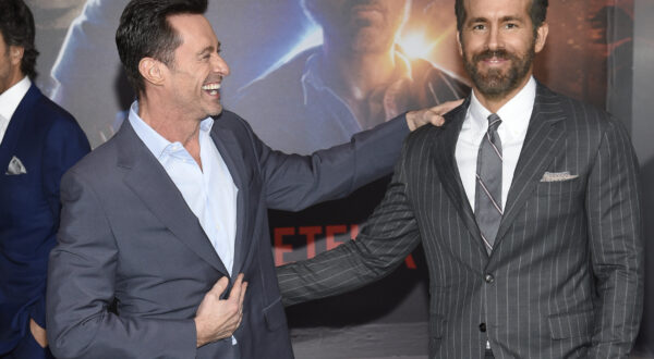 Actors Hugh Jackman, left, and Ryan Reynolds pose together at the world premiere of "The Adam Project" at Alice Tully Hall on Monday, Feb. 28, 2022, in New York. (Photo by Evan Agostini/Invision/AP)