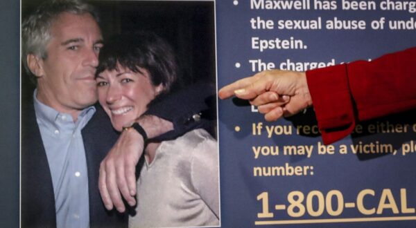 FILE - Audrey Strauss, acting U.S. attorney for the Southern District of New York, points to a photo of Jeffrey Epstein and Ghislaine Maxwell, during a news conference in New York, on July 2, 2020. Maxwell faces the likelihood of years in prison when she is sentenced for helping the wealthy financier Jeffrey Epstein sexually abuse underage girls. The sentencing hearing, Tuesday, June 28, 2022, in New York will be the culmination of a prosecution that detailed how Epstein and Maxwell flaunted their riches and associations with prominent people to groom vulnerable girls and then exploit them. (AP Photo/John Minchillo, File)
