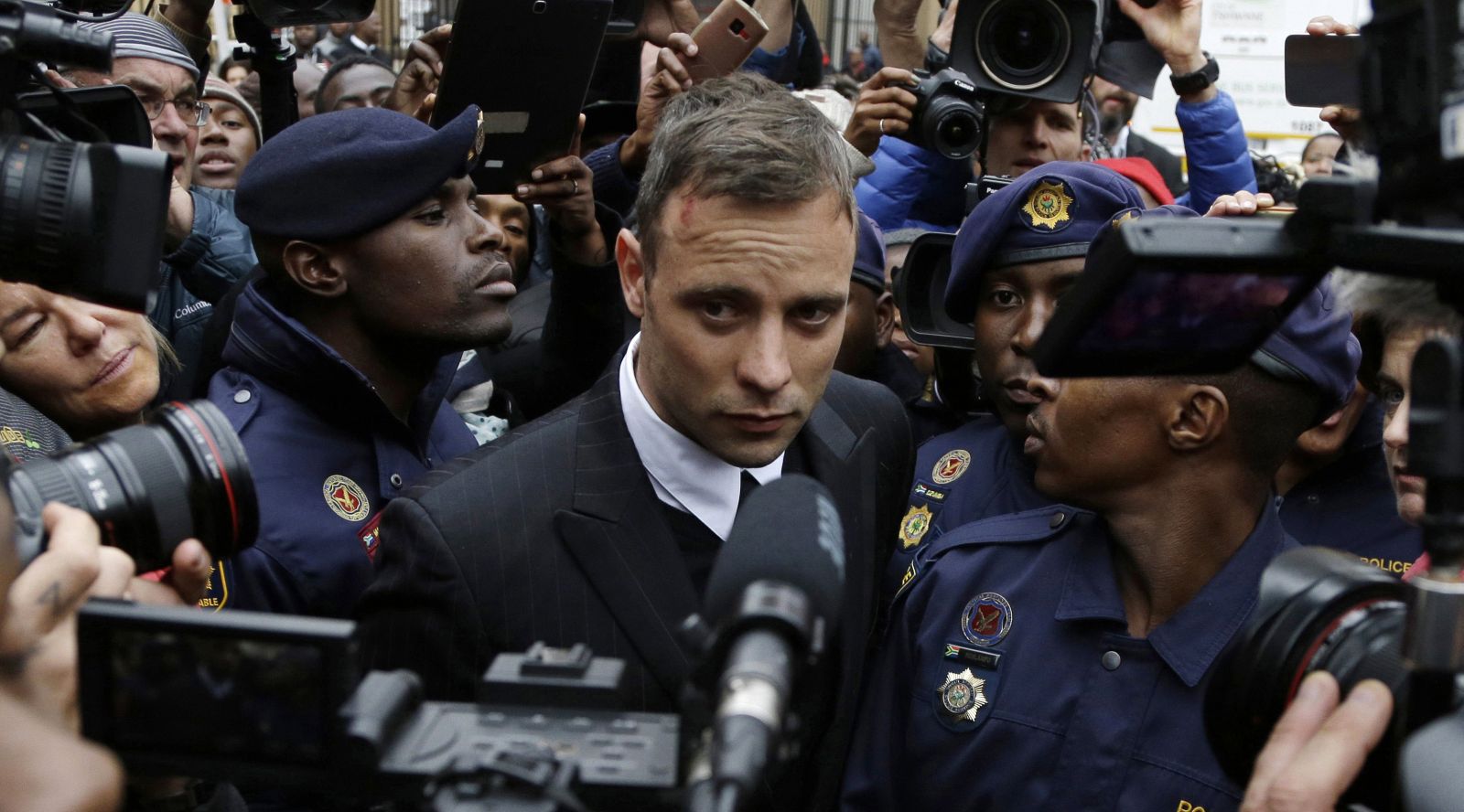 FILE - Oscar Pistorius leaves the High Court in Pretoria, South Africa, on June 14, 2016 during his trail for the murder of girlfriend Reeva Steenkamp. Oscar Pistorius is due on Friday, Jan. 5, 2024 to be released from prison on parole to live under strict conditions at a family home after serving nearly nine years of his murder sentence for the shooting death of girlfriend Reeva Steenkamp on Valentine’s Day 2013. (AP Photo/Themba Hadebe, File)