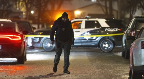 Police work a scene, Monday, Jan. 22, 2024, in Joliet, Ill., after multiple people were shot and killed over two days at three locations in the Chicago suburbs. (Tyler Pasciak LaRiviere/Chicago Sun-Times via AP)