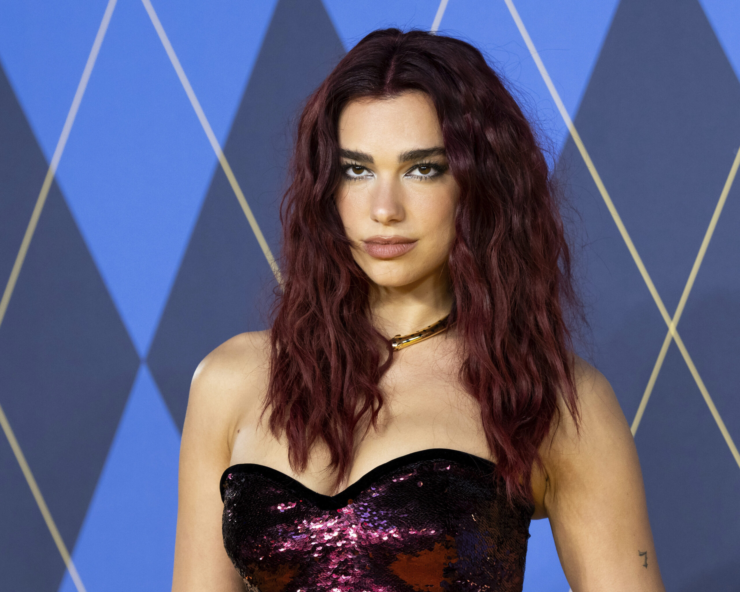 Dua Lipa poses for photographers upon arrival at the World premiere of the film 'Argylle' on Wednesday, Jan. 24, 2024 in London. (Scott A Garfitt/Invision/AP)