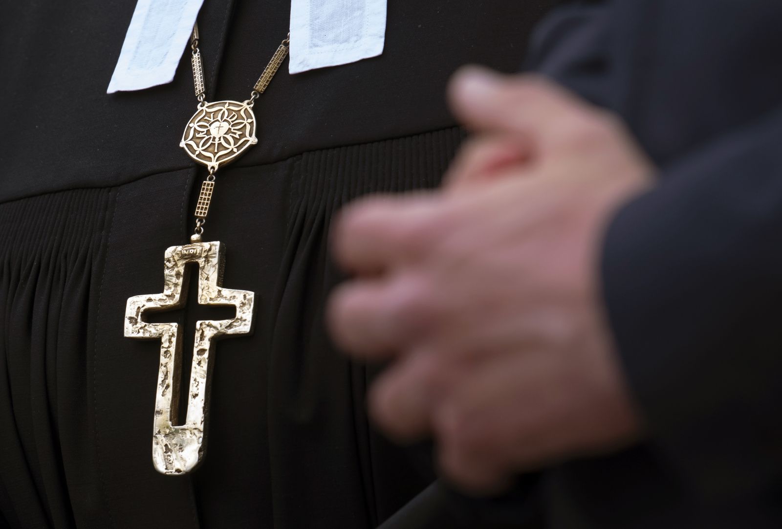 A man prays in Eisenach, Germany, Monday, May 6, 2019. At least 1,259 people working for the Protestant Church of Germany have committed sexual abuse in the last decades and more than 2,225 victims were affected by the abuse according to a comprehensive report that was published Thursday. The numbers are based on the study of documents and files from the regional churches and the Lutheran's diaconal relief and social welfare organization, the Diakonie. (AP Photo/Jens Meyer)