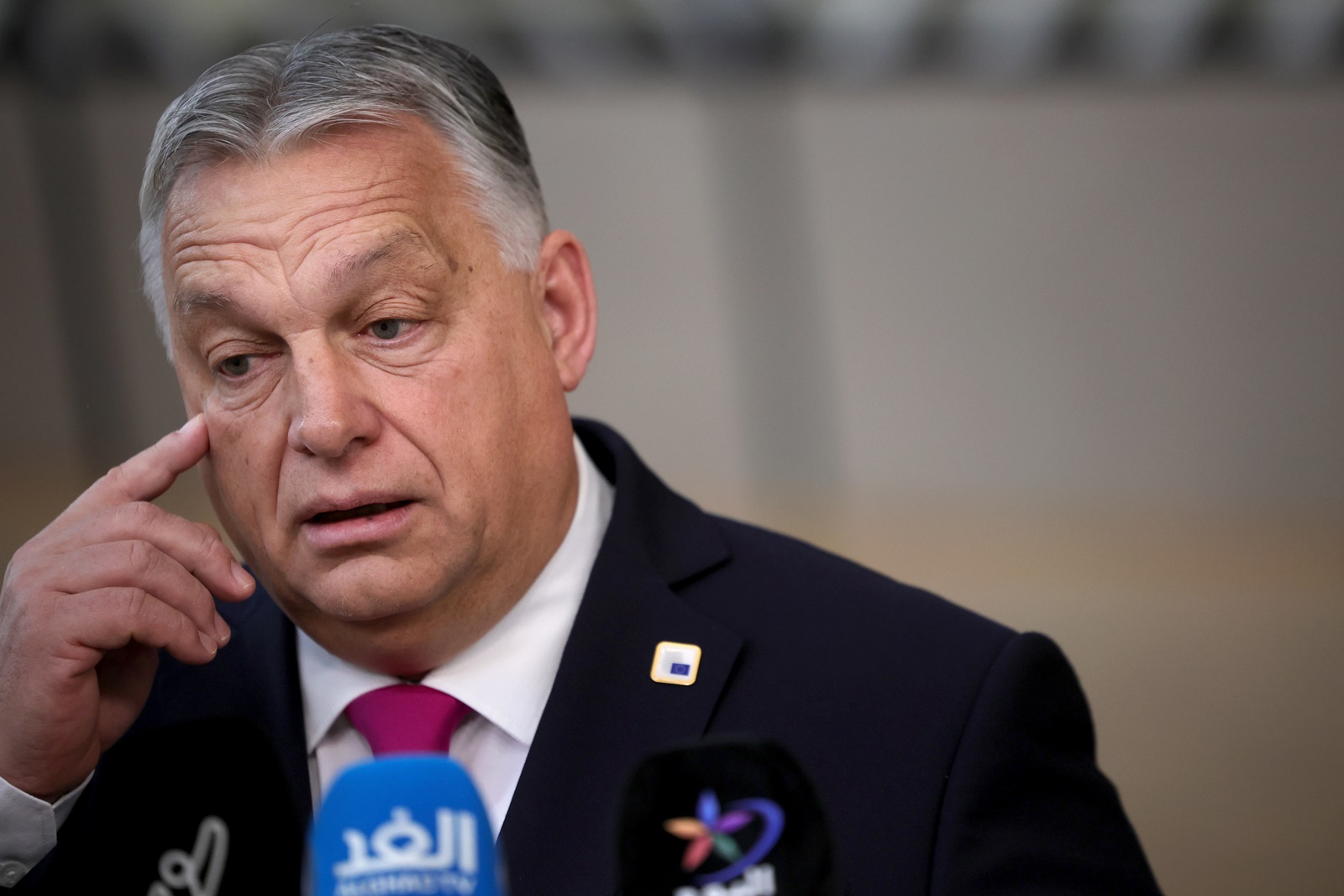 epa11028267 Hungary's Prime Minister Viktor Orban speaks to the media as he arrives for a European Council in Brussels, Belgium, 14 December 2023. EU leaders are gathering in Brussels for a two-day summit to discuss the latest developments in relation to Russia's invasion of Ukraine, and in the Middle East, including the humanitarian situation in Gaza, the block's enlargement policy and long-term budget 2021-2027, as well as security and defense, among other topics.  EPA/OLIVIER MATTHYS