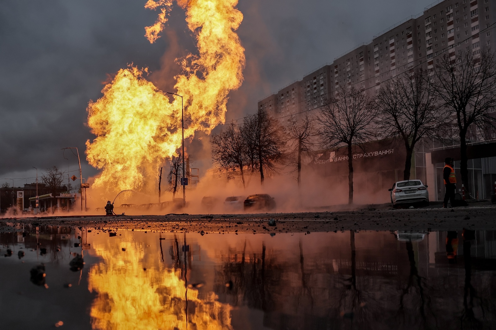 epa11053183 Firefighters work to extinguish a fire near a car dealership after a missile strike in Kyiv (Kiev), Ukraine, 02 January 2024, amid the Russian invasion. In the early hours of 02 January, Russia launched missile attacks targeting Kyiv and Kharkiv, local officials reported. At least two women were killed and nearly 70 others were injured in the two cities. In Kyiv, 27 people were hospitalized after a fire broke out in a multi-story building as a result of a rocket attack, the city mayor Vitali Klitschko wrote on telegram, adding that an injured elderly woman died in an ambulance. Some 130 residents were evacuated from the burning building, the State Emergency Service said.  EPA/OLEG PETRASYUK