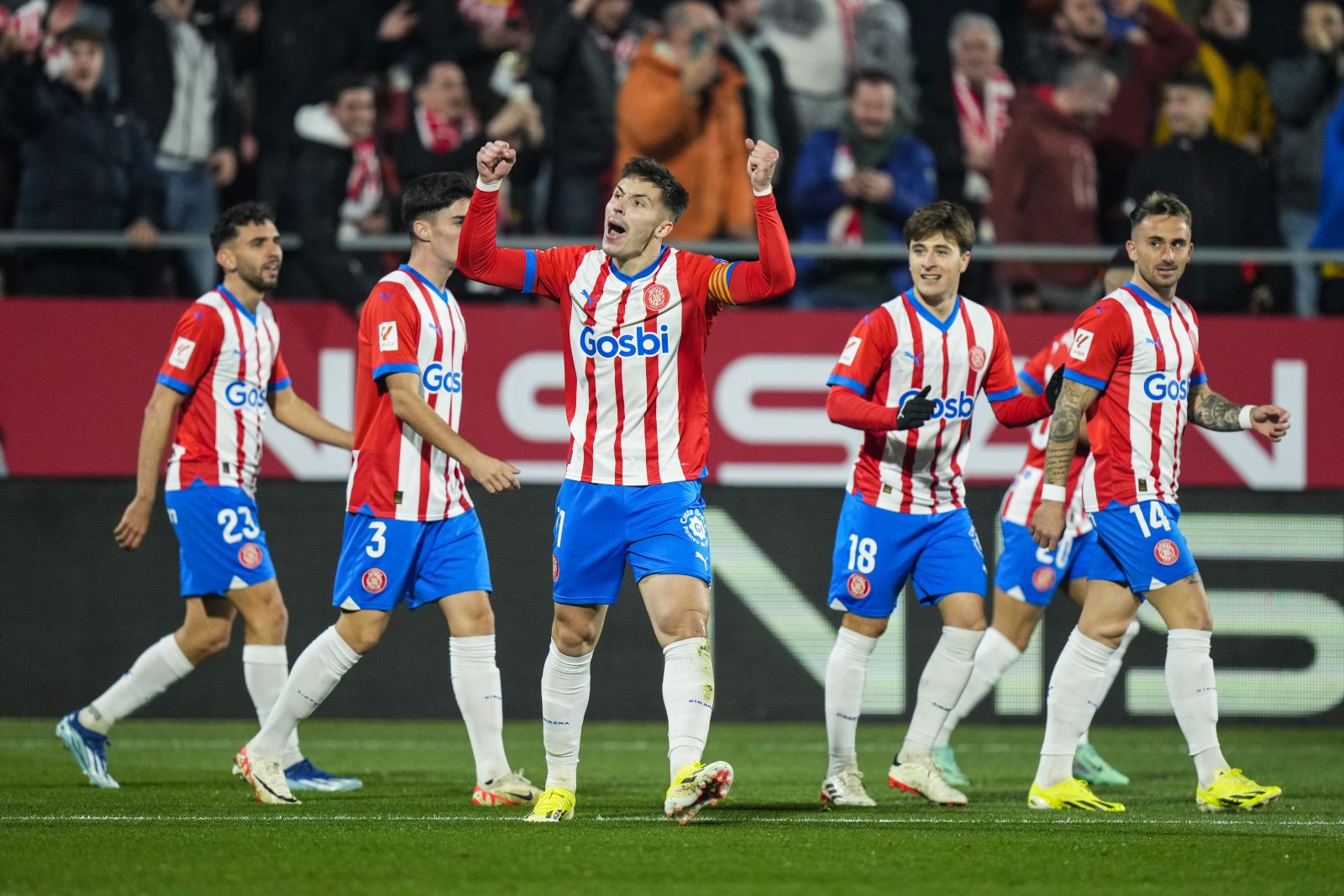 epa11055837 Girona's midfielder Valery Fernandez (C) celebrates after scoring the 1-0 goal during the Spanish LaLiga soccer match between Girona FC and Atletico Madrid, in Girona, Spain, 03 January 2024.  EPA/Siu Wu