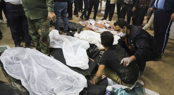 epa11055687 People mourn over bodies of victims after explosions at a commemoration ceremony next to the tomb of Iran's Revolutionary Guards chief of foreign operations Iranian General Qasem Soleimani in the Saheb al-Zaman mosque in the southern city of Kerman, Iran, 03 January 2024. On the fourth anniversary of the assassination of Iranian General Qasem Soleimani, two explosions have killed at least 100 people and another 171 people were wounded near the mausoleum dedicated to him, according to Iranian state television. As part of a ceremony to honor General Soleimani, who was killed in a drone strike in neighboring Iraq in 2020, hundreds of people were on their way towards the grave on 03 January.  EPA/SARE TAJALLI
