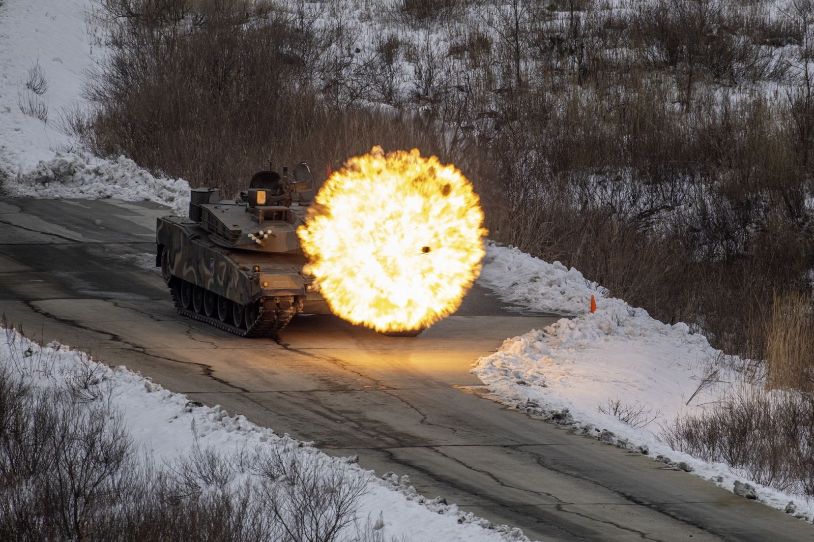 epa11056078 An undated handout photo made available by the South Korean Army shows K1A2 combat tank firing at the Seungjin Fire Training Field in Pocheon, South Korea, (issued 04 January 2024), during live-fire drills that the Army's Capital Mechanized Infantry Division has conducted with US forces since 29 December 2023.  EPA/ROK ARMY / HANDOUT SOUTH KOREA OUT HANDOUT EDITORIAL USE ONLY/NO SALES HANDOUT EDITORIAL USE ONLY/NO SALES