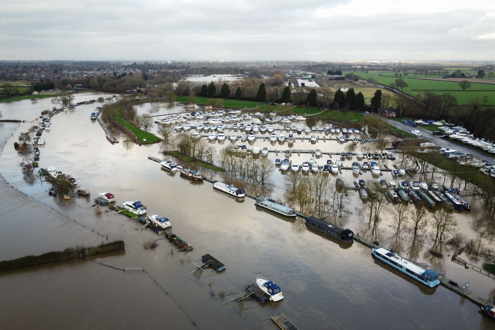 epa11057166 An aerial photograph taken by drone of flooding from the River Ouse near York, Britain, 04 January 2024. Large parts of Britain are still experiencing flood warnings after Storm Henk brought heavy rain to already saturated ground.  EPA/ADAM VAUGHAN