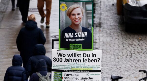 epa11058961 A campaign poster of the right-wing Alternative for Germany (Alternative fuer Deutschland, AfD) party, reading 'Now AfD!', hangs next to a campaign poster of the Green party Alliance 90 / The Greens (Buendnis 90/ Die Gruenen) on a lamp post in Steglitz district in Berlin, Germany, 05 January 2024. On 19 December 2023, the German Federal Constitutional Court ruled that the election to the 20th German Bundestag must be repeated in 455 Berlin constituencies. The date for the partial election rerun is 11 February 2024.  EPA/FILIP SINGER