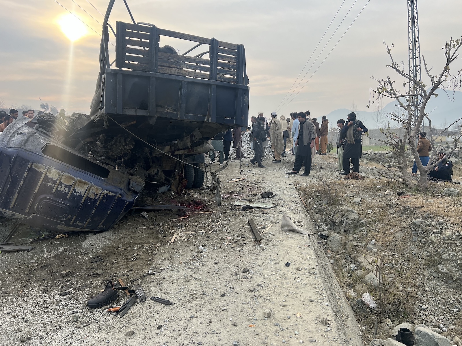 epa11063942 Pakistani security officials inspect the scene of a bomb blast that targeted the police near the Afghan border in Bajaur, Pakistan, 08 January 2024. Five police officers were killed and nearly two dozen others wounded in an explosive attack targeting their vehicle during a polio vaccination drive in northwestern Pakistan, police said. The blast occurred in Bajaur, a tribal district in Khyber Pakhtunkhwa province, as the vaccination campaign began. No group has claimed responsibility for the attack, but the Pakistani Taliban has previously targeted polio vaccination workers and security officials. Resistance to the immunization drive has grown due to historical CIA involvement and misinformation spread by religious leaders. Both Pakistan and Afghanistan are yet to be declared free of the wild poliovirus type 1, with Pakistan reporting a considerable reduction in polio cases in 2023. The attack on the vaccination team comes amid a surge in violent incidents in Pakistan, with over 600 attacks and more than 950 fatalities reported in 2023, according to data compiled by the Pakistan Institute of Conflict and Security Studies, a research organization based in Islamabad.  EPA/HANIFULLAH KHAN