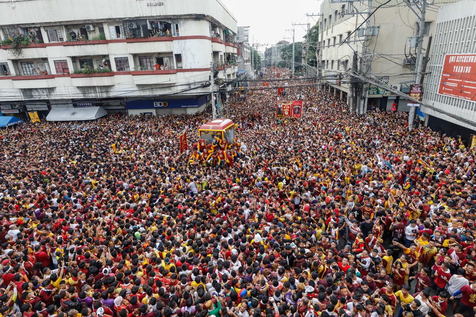 epa11065280 Catholic devotees participate in the procession marking the feast day of the Black Nazarene at the Quirino Grandstand park in Manila, Philippines, 09 January 2024. The Black Nazarene feast day honoring Jesus Christ is one of the first major celebrations for Catholics at the start of every year, and is highlighted by a whole day procession of barefoot devotees.  EPA/ROLEX DELA PENA