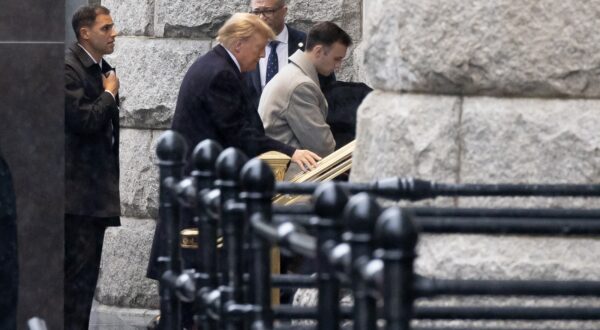 epa11066259 US President Donald J. Trump (C) enters a hotel to make a statement to members of the news media after leaving the E. Barrett Prettyman United States Courthouse in Washington, DC, USA, 09 January 2024. Trump attended his hearing at the E. Barrett Prettyman United States Courthouse as his lawyers tried to convince three federal appeals court judges that the former US president is immune from charges related to his efforts to overturn the 2020 presidential election.  EPA/MICHAEL REYNOLDS