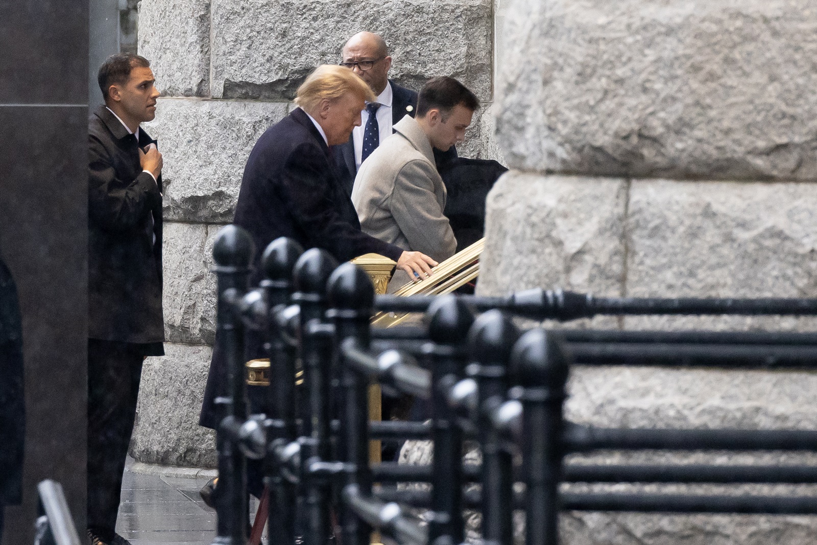 epa11066259 US President Donald J. Trump (C) enters a hotel to make a statement to members of the news media after leaving the E. Barrett Prettyman United States Courthouse in Washington, DC, USA, 09 January 2024. Trump attended his hearing at the E. Barrett Prettyman United States Courthouse as his lawyers tried to convince three federal appeals court judges that the former US president is immune from charges related to his efforts to overturn the 2020 presidential election.  EPA/MICHAEL REYNOLDS