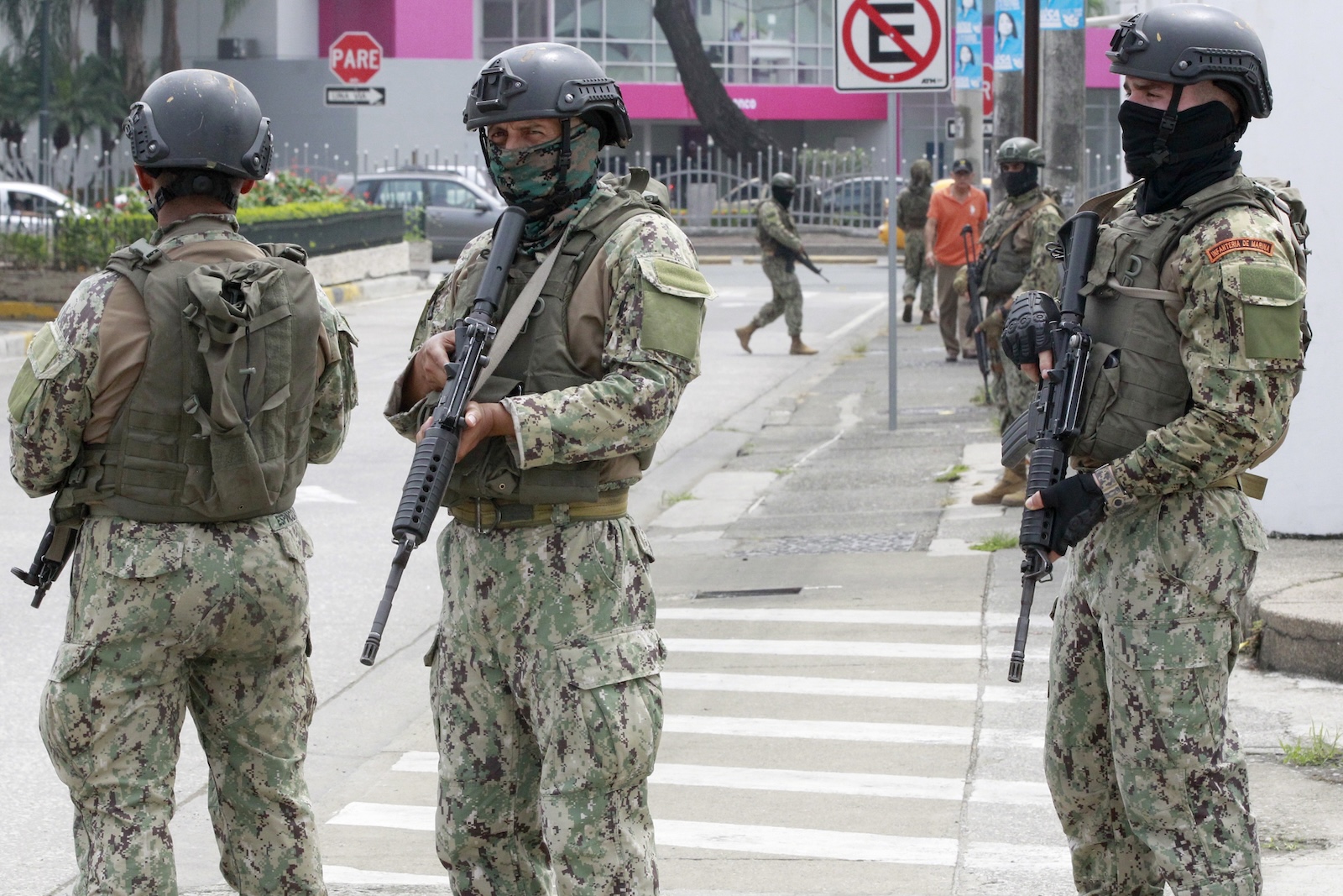 epa11072732 Members of Ecuador Armed Forces stand guard outside TC Television channel during a visit of President Daniel Noboa, in Guayaquil, Ecuador, 12 January 2024. Ecuador is in turmoil after TC Television channel was assaulted by armed men during a live broadcast on January 9, taking hostages of employees on the spot. President Daniel Noboa declared the nation in 'internal armed conflict' after the incident, ordering security forces to 'neutralize' criminal groups accused of spreading violence in the country.  EPA/Carlos DurÃ¡n AraÃºjo