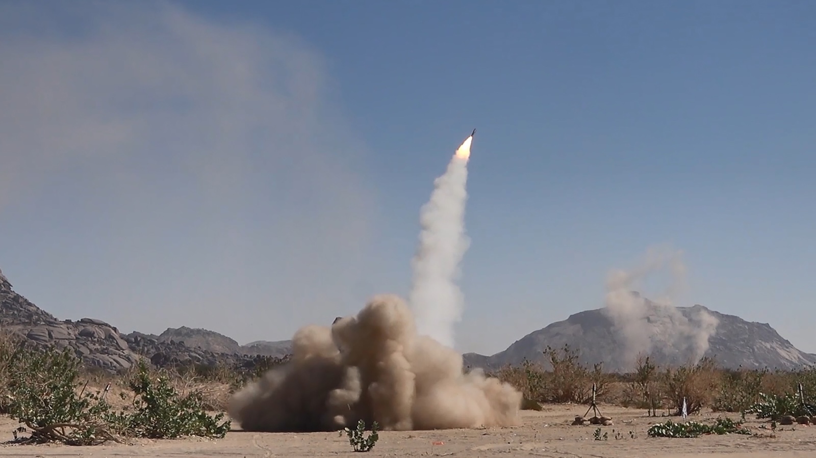 epa11074271 A handout photo made available by the Houthis Media Center on 13 January 2024 shows a projectile being launched during a military exercise near the Yemen-Saudi Arabia border at Al-Baqaa area in the northern province of Saada, Yemen, 11 January 2024. The Houthi-run al-Masirah TV has reported that new airstrikes were carried out on 13 January 2024 on a Houthi military site in Sana'a, a day after the United States and Britain carried out military strikes on several Houthis-controlled sites in Yemen in response to recent Houthis attacks on ships in the Red Sea. The US Department of Defense in December 2023 announced a multinational operation to safeguard trade and to protect ships in the Red Sea amid the recent escalation in Houthi attacks. Houthis vowed to attack Israeli-bound ships and prevent them from navigating in the Red Sea and the Bab al-Mandab Strait in retaliation for Israel's airstrikes on the Gaza Strip.  EPA/HOUTHIS MEDIA CENTER HANDOUT -- BEST QUALITY AVAILABLE -- HANDOUT EDITORIAL USE ONLY/NO SALES HANDOUT EDITORIAL USE ONLY/NO SALES