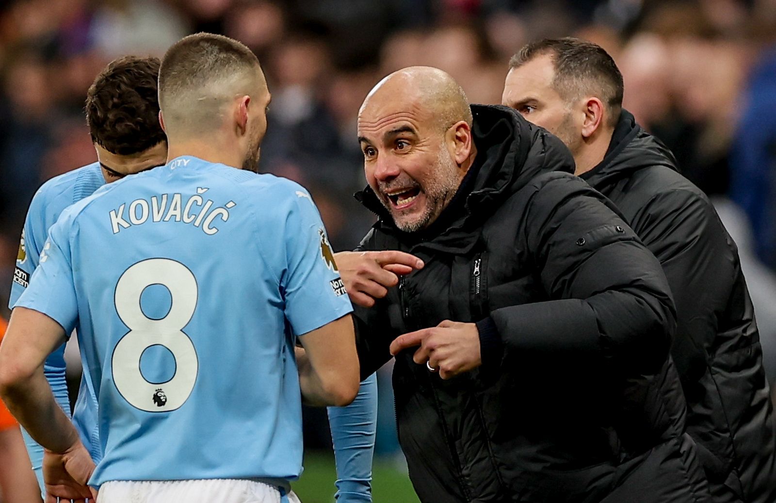epa11074439 Manchester City manager Pep Guardiola (R) talks with Mateo Kovacic of Manchester City (L) during the English Premier League match between Newcastle United and Manchester City in Newcastle, Britain, 13 January 2024.  EPA/ADAM VAUGHAN EDITORIAL USE ONLY. No use with unauthorized audio, video, data, fixture lists, club/league logos, 'live' services or NFTs. Online in-match use limited to 120 images, no video emulation. No use in betting, games or single club/league/player publications.