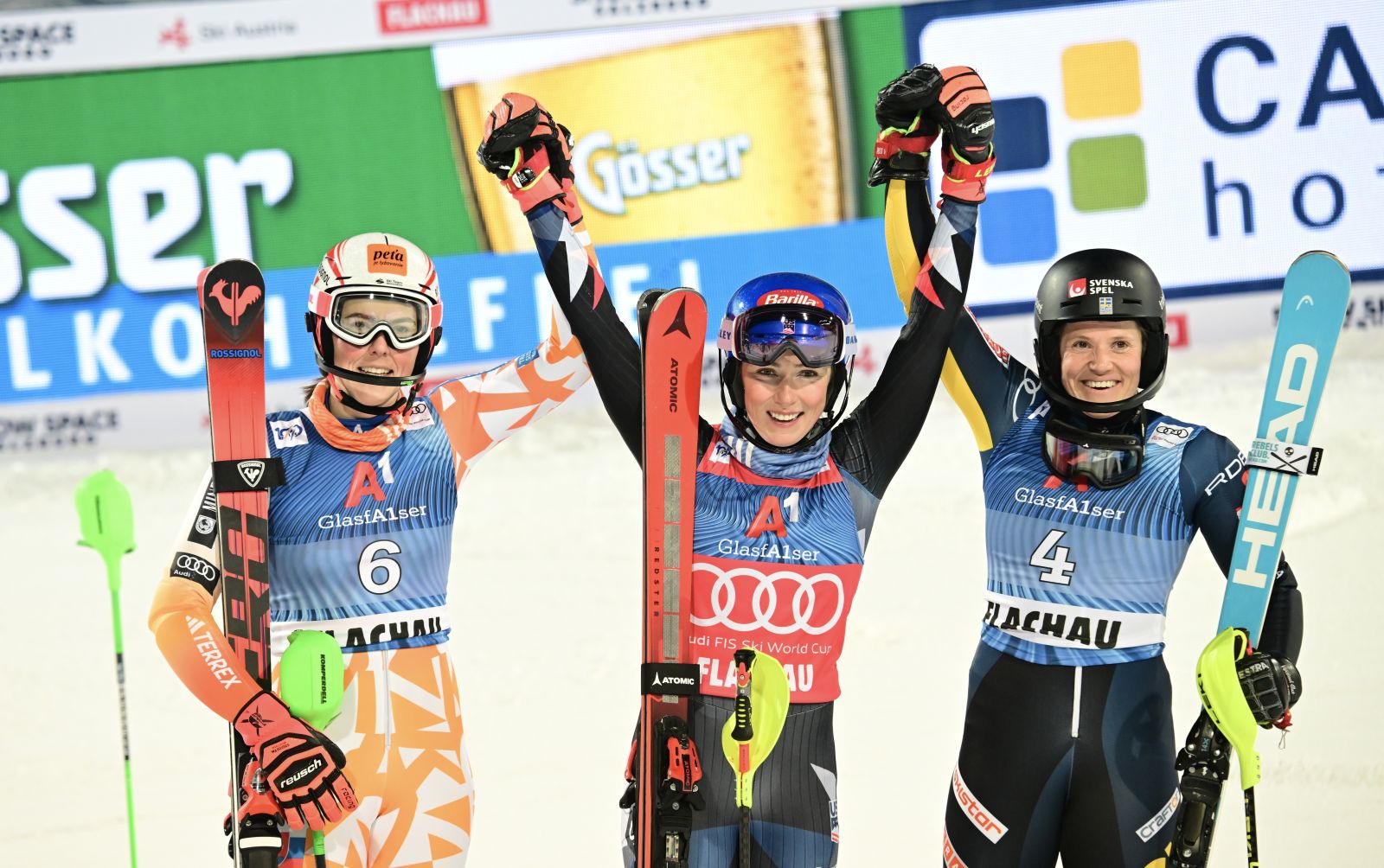 epa11083595 (L-R) Second placed Petra Vlhova of Slovakia, winner Mikaela Shiffrin of the USA, and third placed Sara Hector of Sweden celebrate after the Women's Slalom race at the FIS Alpine Skiing World Cup in Flachau, Austria, 16 January 2024.  EPA/CHRISTIAN BRUNA