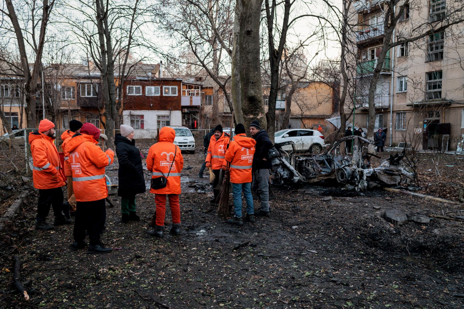 epa11084437 Communal workers inspect the site of a Russian drone attack in Odesa, Ukraine, 17 January 2024, amid the Russian invasion. At least three people were injured and 130 others evacuated from an apartment block after a Russian drone strike hit Odesa in an overnight attack, according to Oleg Kiper, Odesa's head of military administration.  EPA/Ihor Hora