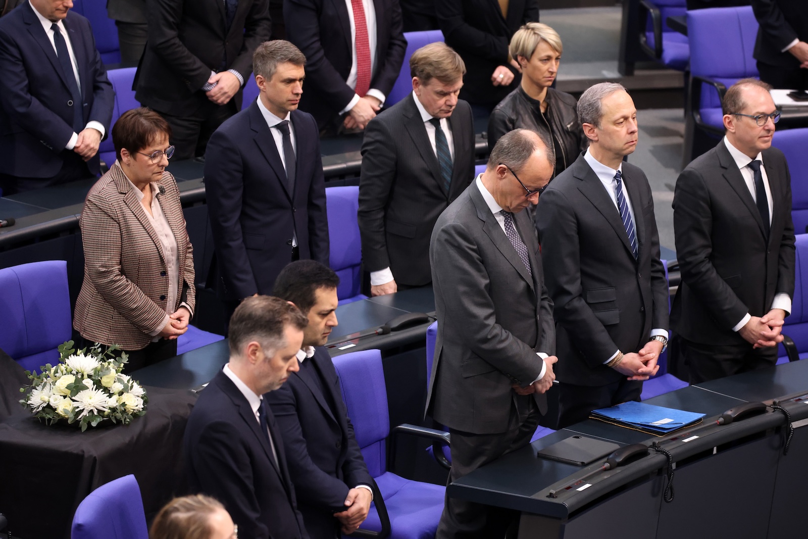 epa11084951 Members of CDU faction, among them Chairman of the Christian Democratic Union (CDU) party and faction, Friedrich Merz (front-C), stand during a minute of silence for deceased former German Parliament â€˜Bundestagâ€™ president Wolfgang Schaeuble prior to a government question time at the parliament in Berlin, Germany, 17 January 2024. During the question time of the German government, German Minister for Economy and Climate Robert Habeck and German Minister for Economic Cooperation and Development Svenja Schulze are meant to answer questions of Members of Parliament.  EPA/CLEMENS BILAN