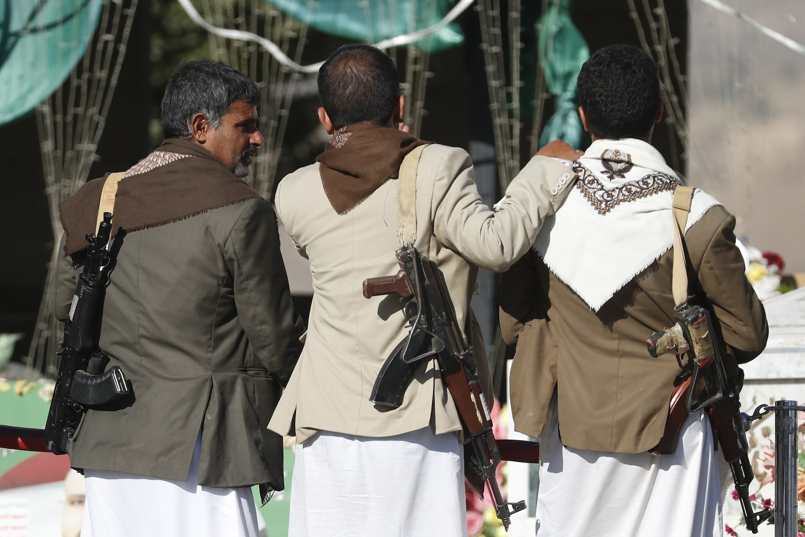 epa11085958 Armed Houthi fighters visit a shrine of slain Houthi fighters, in Sana'a, Yemen, 17 January 2024. The United States announced the designation of Yemen's Houthis as a global terror group amid an escalation of their attacks on shipping lanes in the Red Sea, the Bab al-Mandab Strait and the Gulf of Aden since November 2023. The US Department of Defense had announced in December 2023 a multinational operation to safeguard trade and to protect ships in the Red Sea amid the recent escalation in Houthi attacks. Houthis vowed to keep up attacks on Israeli-bound ships and prevent them from navigating in the Red Sea and the Bab al-Mandab Strait in retaliation for Israel's airstrikes on the Gaza Strip, according to statements by Houthis' military spokesman Yahya Sarea.  EPA/YAHYA ARHAB