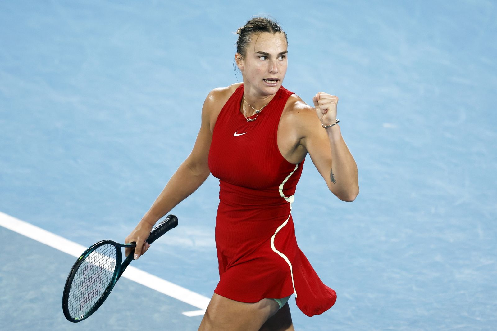epa11093177 Aryna Sabalenka of Belarus reacts after match point against Amanda Anisimova of the USA during the Women's 4th round match at the Australian Open tennis tournament in Melbourne, Australia, 21 January 2024.  EPA/MAST IRHAM