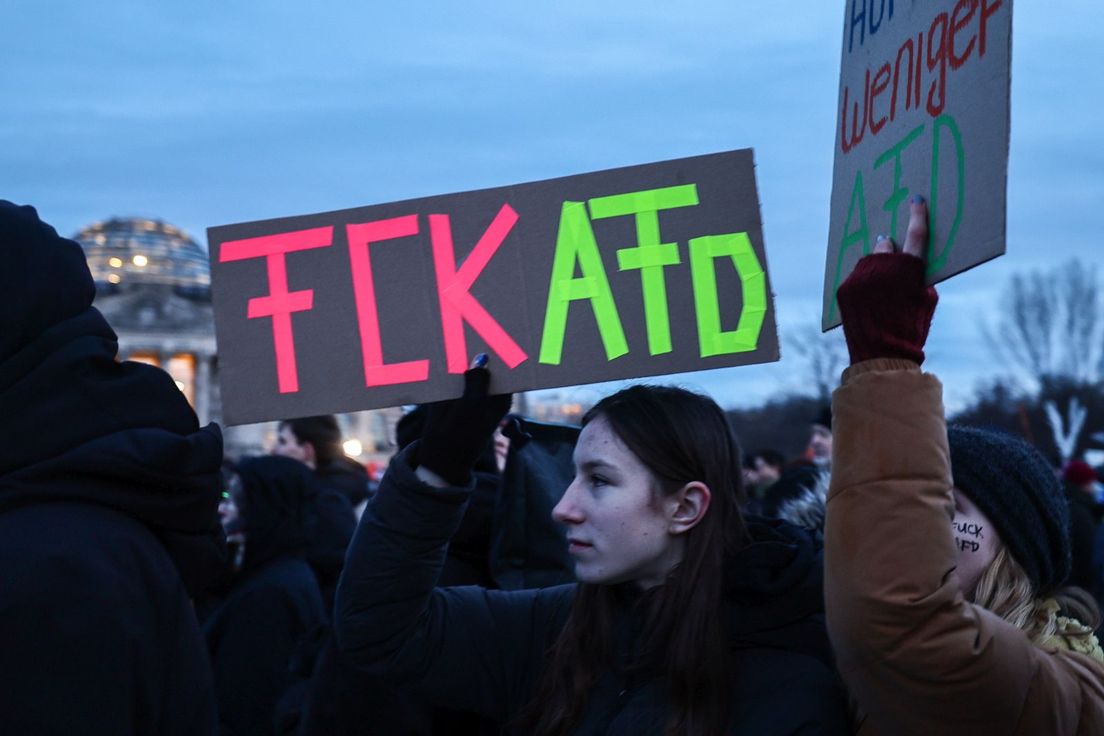 epa11094568 Protesters gather in front of German parliament Bundestag, during a demonstration against the far-right Alternative for Germany (AfD) party in Berlin, Germany, 21 January 2024. The protest held under the slogan 'Defend Democracy', was organized by the Fridays for Future movement, along with other non-governmental organizations, as a reaction to revelations of the investigative journalism group Correctiv, and their report about a meeting of far-right politicians, who allegedly discussed deportation plans referred to as 'remigration', a term promoting the forced return of 'migrants' to their place of origin.  EPA/FILIP SINGER