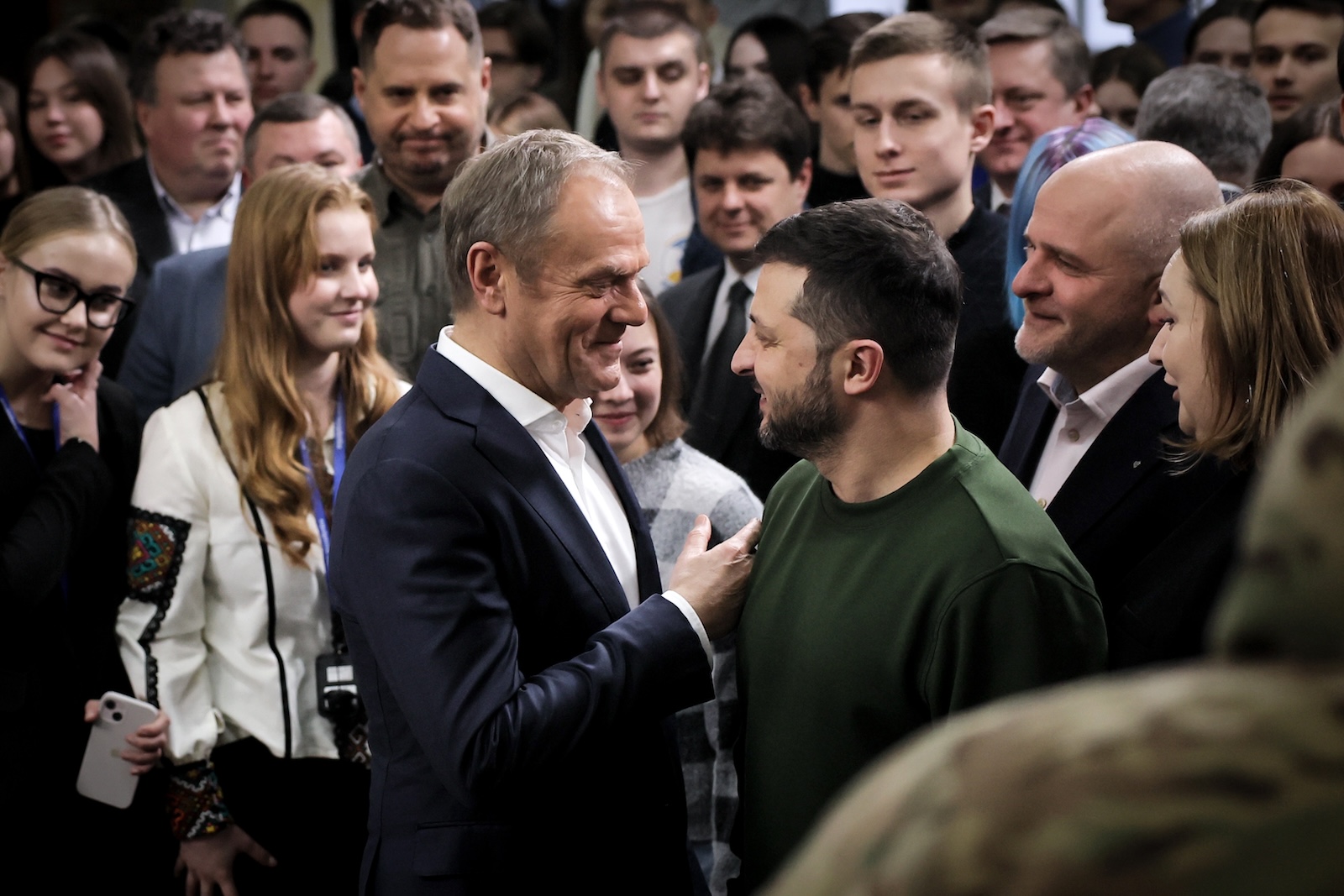 epa11096249 Ukrainian President Volodymyr Zelensky (C-R) and Polish Prime Minister Donald Tusk (C-L) leave after attending a meeting with Ukrainian students in Kyiv (Kiev), Ukraine, 22Â January 2024.  EPA/Oleg Petrasyuk