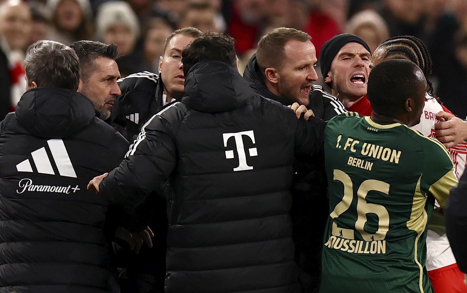 epa11102170 Munich's Leroy Sane (R) and Union’s head coach Nenad Bjelica (L) interact during the German Bundesliga soccer match between FC Bayern Munich and Union Berlin in Munich, Germany, 24 January 2024.  EPA/ANNA SZILAGYI CONDITIONS - ATTENTION: The DFL regulations prohibit any use of photographs as image sequences and/or quasi-video.