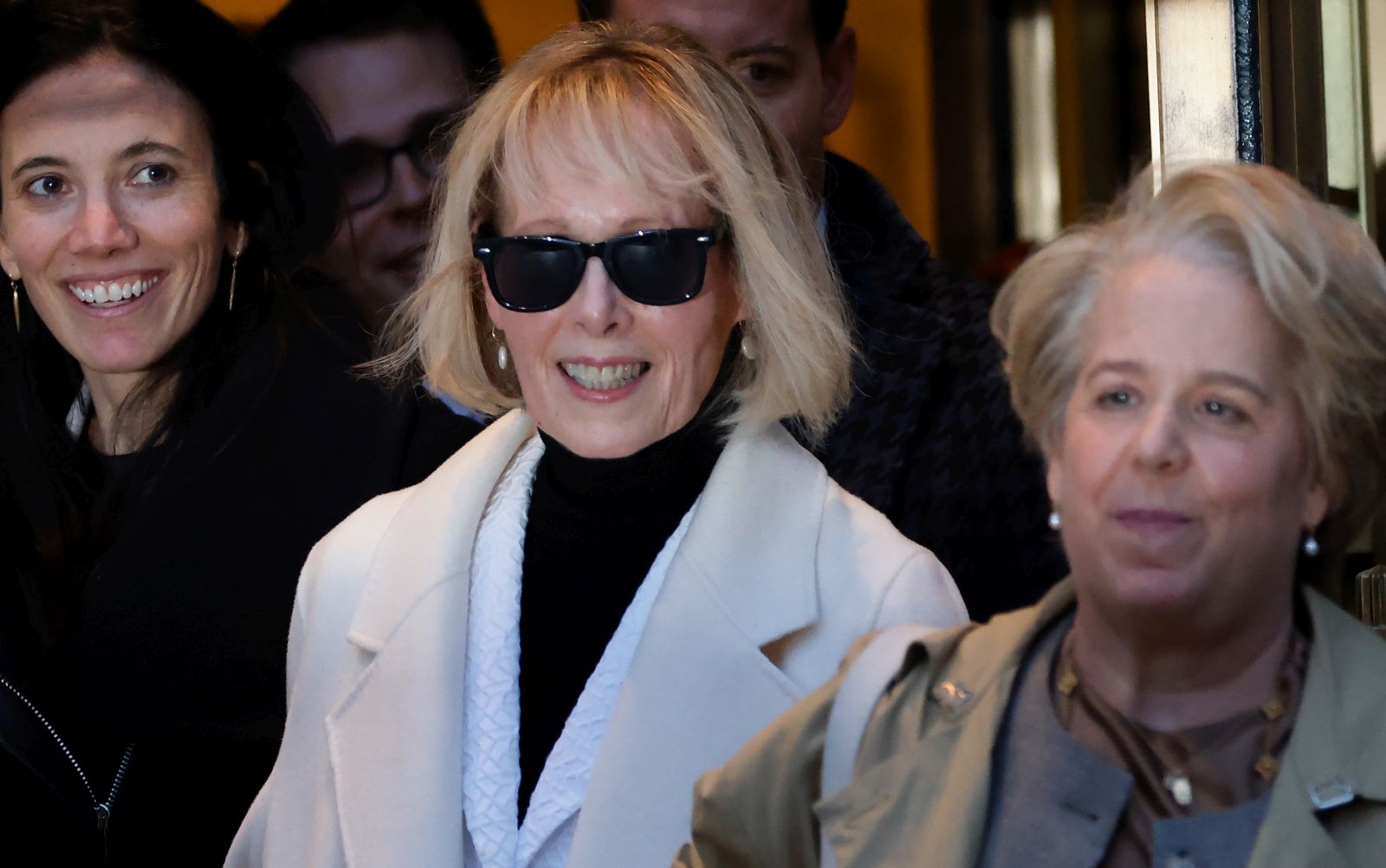 epa11107065 Journalist E. Jean Carroll  (C) exits Federal Court at the conclusion of her second Civil Defamation Trial against former US President Donald J. Trump in New York, New York, USA, 26 January 2024. The jury in the first case found Trump sexually abused Carroll and she was awarded five million dollars. This time the jury awarded her a total of 83.3 million US dollars (about EUR 77 million) in damages for defamation.  EPA/Peter Foley
