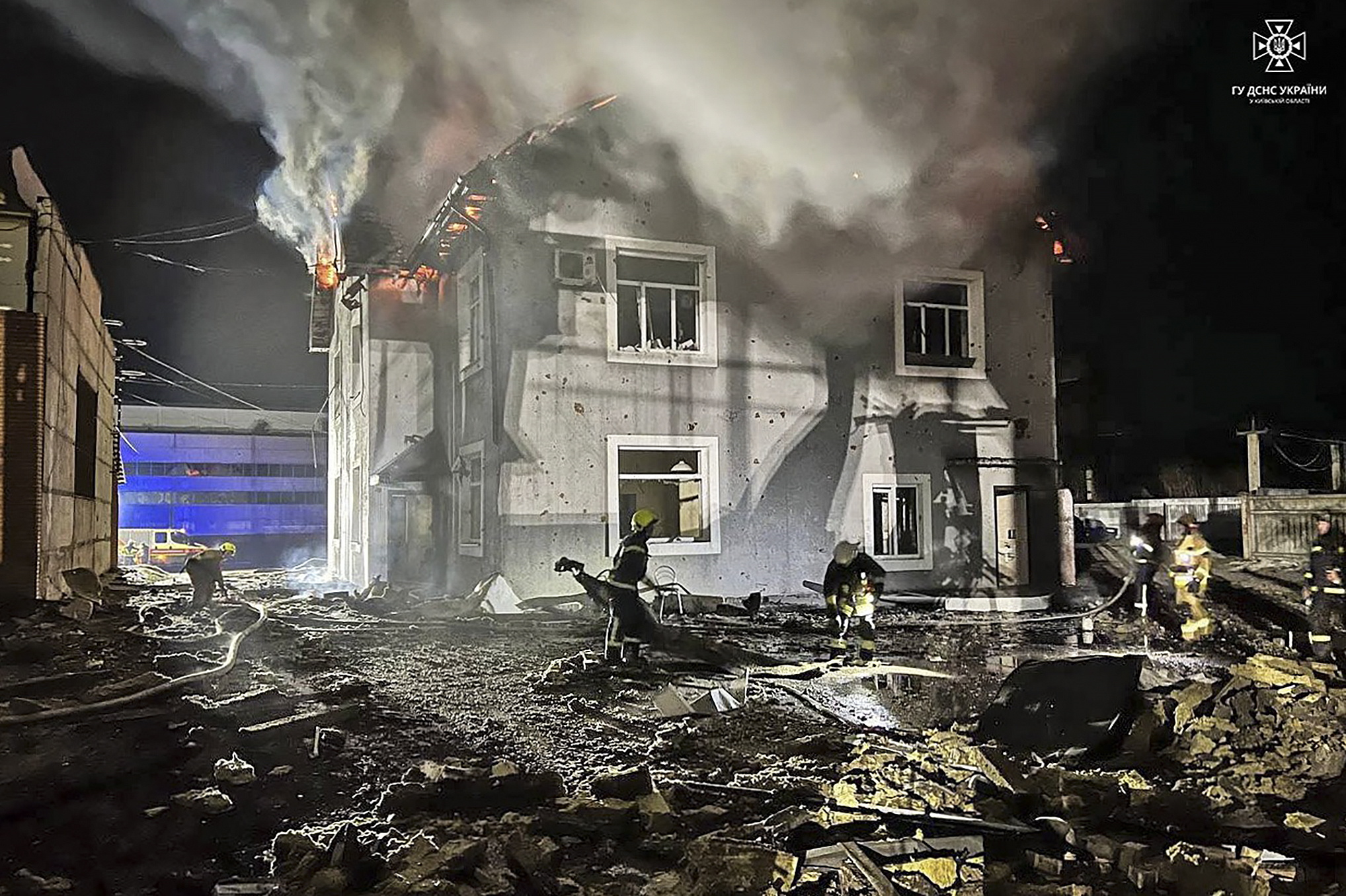epa11113565 A handout picture made available by the State Emergency Service shows Ukrainian rescuers working on the site of an overnight drone attack on an administrative building in the Kyiv region, Ukraine, 30 January 2024. Thirty-five Russian shock drones in total were involved in the overnight attack on Ukraine, 15 of them were shot down, according to Ukraine's Air Force Command of the Armed Forces. Nobody was killed or injured during that attack.  EPA/STATE EMERGENCY SERVICE HANDOUT HANDOUT  HANDOUT EDITORIAL USE ONLY/NO SALES HANDOUT EDITORIAL USE ONLY/NO SALES