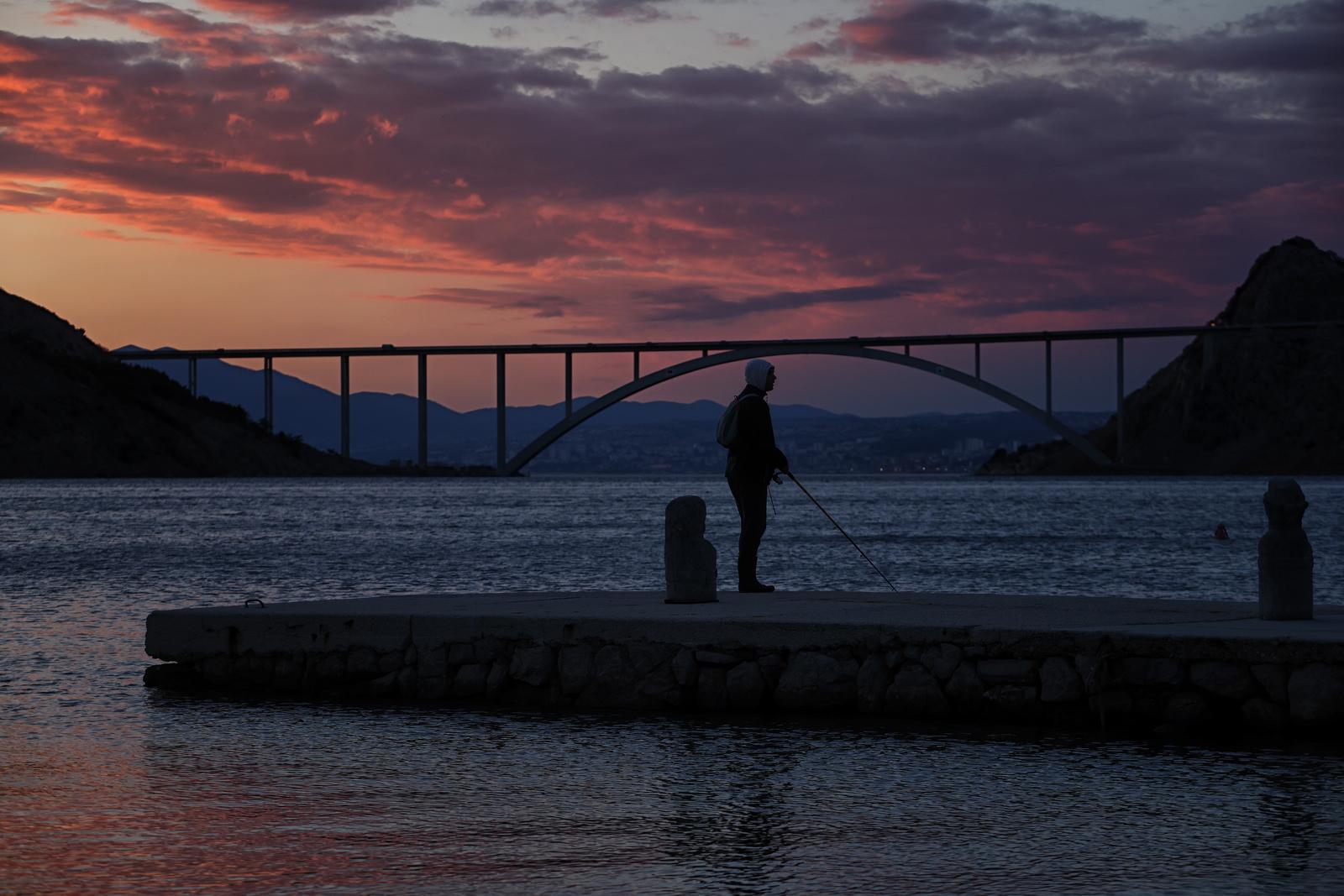11.03..2023. Krk- Zalazak sunca i ribolov u uvali Voz ispod Krckog mosta. Photo: Boris Scitar/PIXSELL
