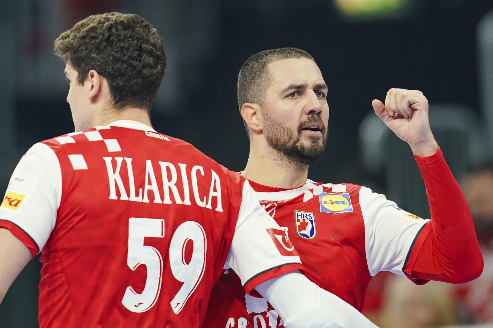 14 January 2024, Baden-Württemberg, Mannheim: Handball: European Championship, Croatia - Austria, preliminary round, Group B, match day 2, SAP Arena. Croatia's Mario Sostaric (r) celebrates a goal with Croatia's Luka Lovre Klarica. Photo: Uwe Anspach/dpa Photo: Uwe Anspach/DPA Photo: Uwe Anspach/DPA/PIXSELL/PIXSELL