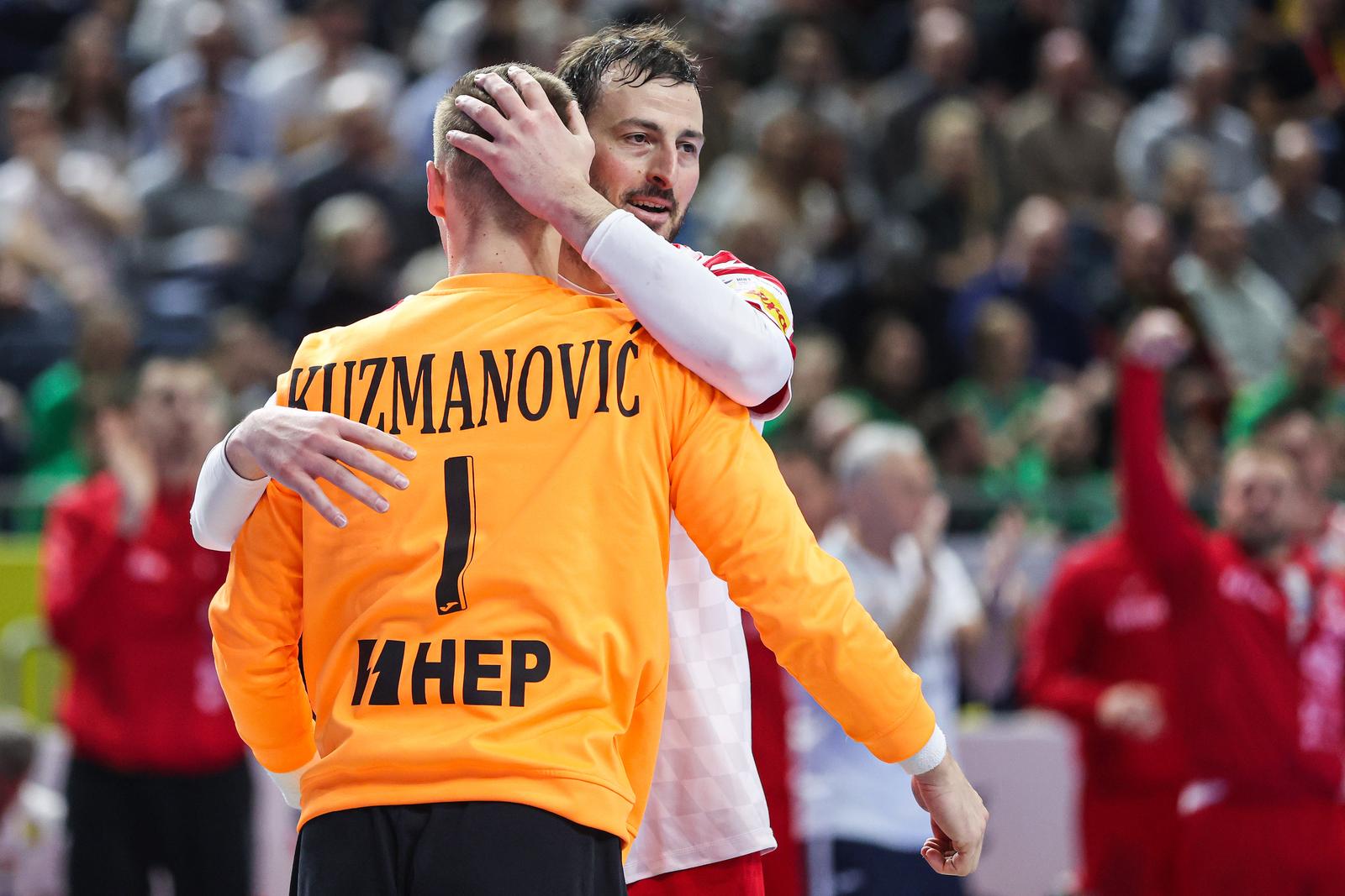 22.01.2024., Lanxess Arena, Koeln, Njemacka - EHF Europsko prvenstvo u rukometu 2024. u Njemackoj. Drugi krug, skupina 1, Njemacka - Hrvatska. Domagoj Duvnjak, Dominik Kuzmanovic Photo: Sanjin Strukic/PIXSELL