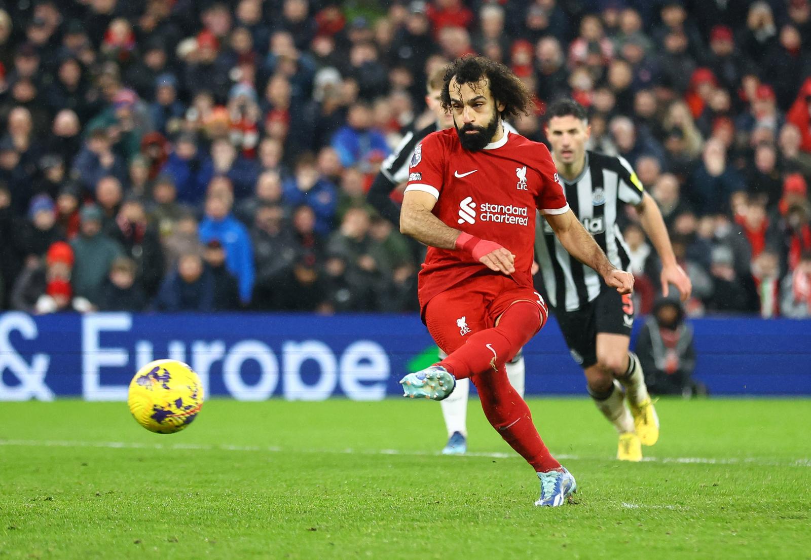 Soccer Football - Premier League - Liverpool v Newcastle United - Anfield, Liverpool, Britain - January 1, 2024 Liverpool's Mohamed Salah scores their fourth goal from the penalty spot REUTERS/Carl Recine NO USE WITH UNAUTHORIZED AUDIO, VIDEO, DATA, FIXTURE LISTS, CLUB/LEAGUE LOGOS OR 'LIVE' SERVICES. ONLINE IN-MATCH USE LIMITED TO 45 IMAGES, NO VIDEO EMULATION. NO USE IN BETTING, GAMES OR SINGLE CLUB/LEAGUE/PLAYER PUBLICATIONS. Photo: Carl Recine/REUTERS