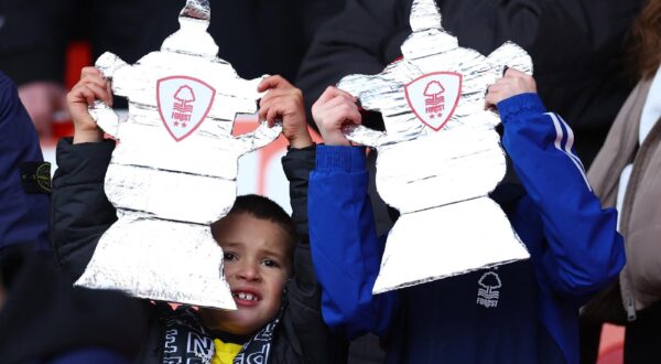 Soccer Football -  FA Cup - Third Round - Nottingham Forest v Blackpool - The City Ground, Nottingham, Britain - January 7, 2024 Nottingham Forest fans holding a cut out of the FA Cup trophy inside the stadium before the match REUTERS/Molly Darlington Photo: MOLLY DARLINGTON/REUTERS