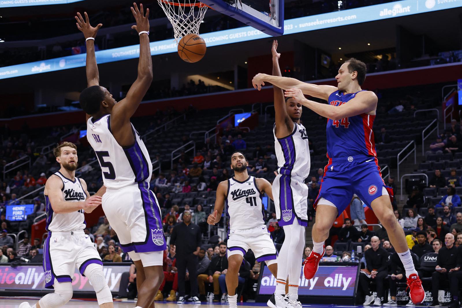 Jan 9, 2024; Detroit, Michigan, USA;  Detroit Pistons forward Bojan Bogdanovic (44) passes on on Sacramento Kings guard De'Aaron Fox (5) in the second half at Little Caesars Arena. Mandatory Credit: Rick Osentoski-USA TODAY Sports Photo: Rick Osentoski/REUTERS