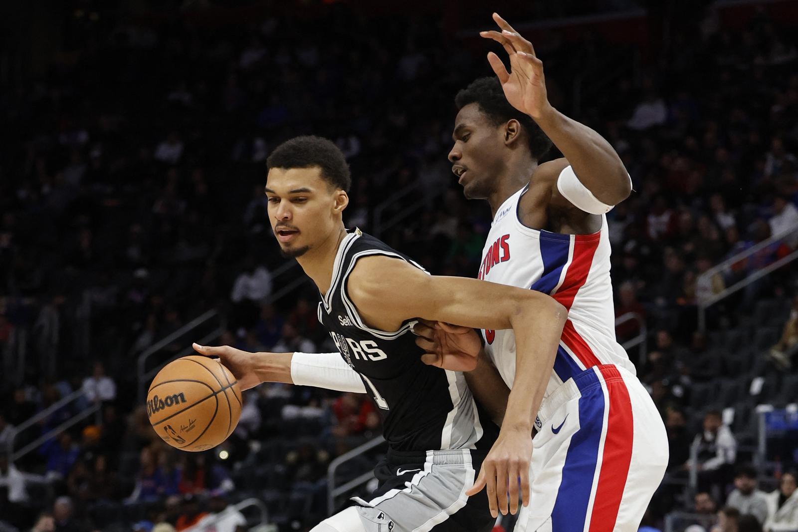 Jan 10, 2024; Detroit, Michigan, USA;  San Antonio Spurs center Victor Wembanyama (1) dribbles defended by Detroit Pistons center Jalen Duren (0) in the second half at Little Caesars Arena. Mandatory Credit: Rick Osentoski-USA TODAY Sports Photo: Rick Osentoski/REUTERS