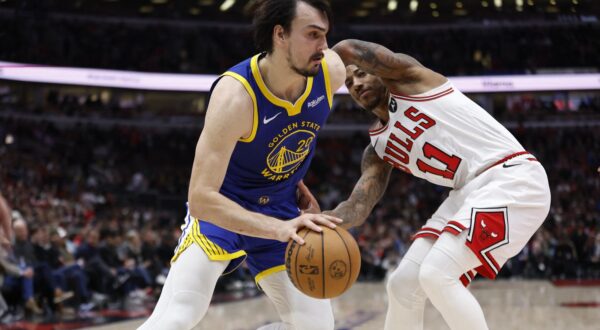 Jan 12, 2024; Chicago, Illinois, USA; Golden State Warriors forward Dario Saric (20) drives against Chicago Bulls forward DeMar DeRozan (11) during the first half at United Center. Mandatory Credit: Kamil Krzaczynski-USA TODAY Sports Photo: KAMIL KRZACZYNSKI/REUTERS