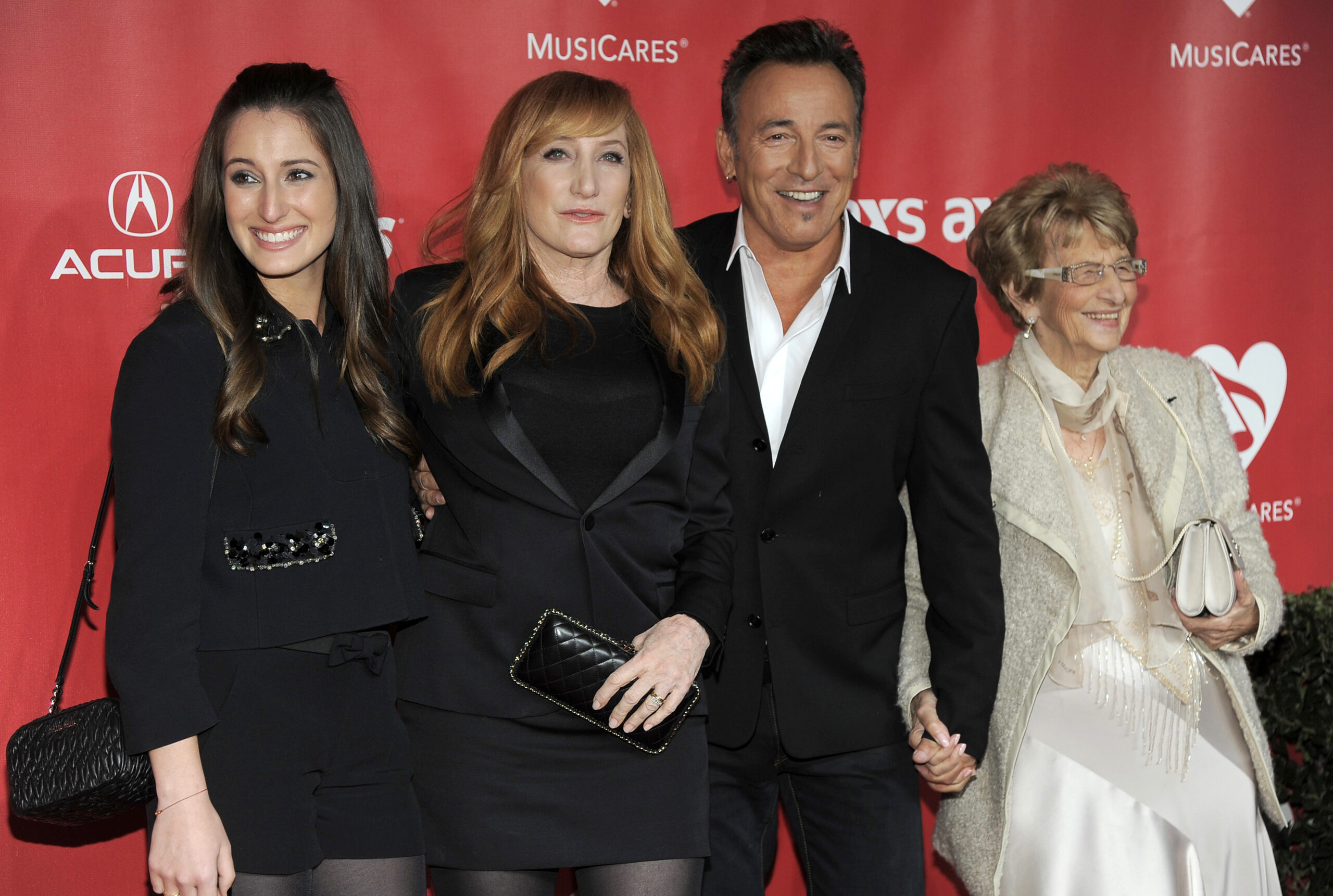 FILE - In this Feb. 8, 2013 file photo, from left, Jessica Rae Springsteen, Patti Scialfa, honoree Bruce Springsteen, and Adele Springsteen arrive at the MusiCares Person of the Year tribute honoring Bruce Springsteen in Los Angeles. Springsteen and his mom, Adele, danced to two songs Sunday, April 15, 2018, at the Wonder Bar in Asbury Park, N.J., before severe storms caused the club to lose power. They were there to see the Eddie Testa Band, reportedly one of Adele's favorite bands. Adele Springsteen turns 93 on May 4. (Photo by Chris Pizzello/Invision/AP, File)
