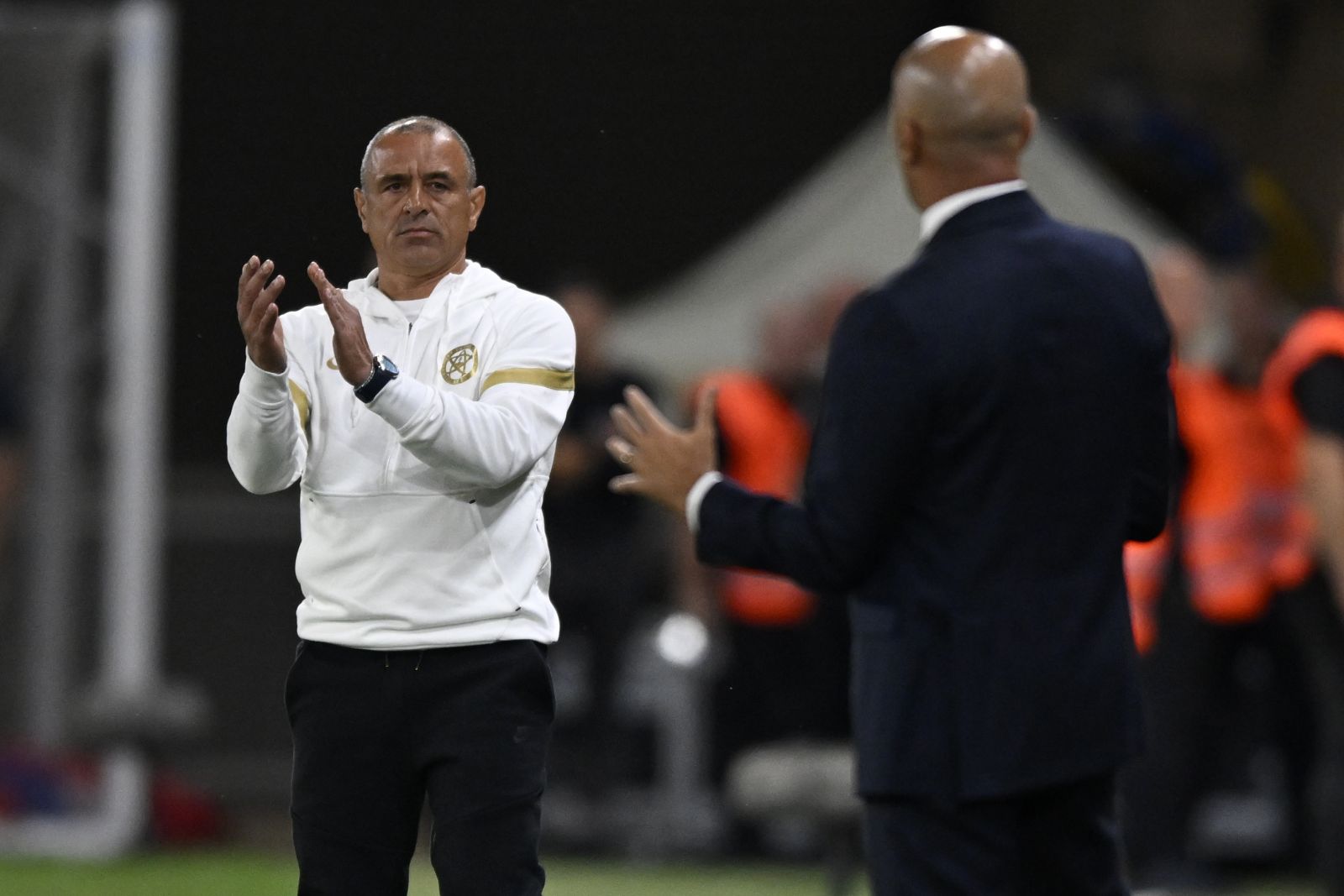 Slovakia's head coach Francesco Calzona, left, gestures during the Euro 2024 group J qualifying soccer match between Slovakia and Portugal at the National Football Stadium in Bratislava, Slovakia, Friday, Sept. 8, 2023. (AP Photo/Radovan Stoklasa)