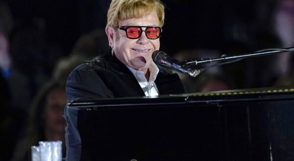 FILE - Elton John performs on the South Lawn of the White House in Washington on Sept. 23, 2022. John has achieved EGOT status. The famed British singer-pianist secured an Emmy Award on Monday night, Jan. 15, 2024, for best variety special (live) for “Elton John Live: Farewell from Dodger Stadium,” a three-hour concert documentary that streamed on Disney +.  (AP Photo/Susan Walsh, File)