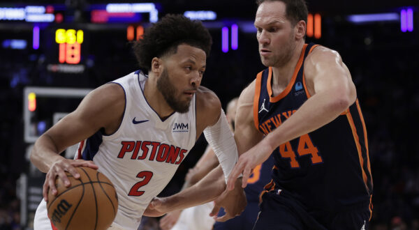 Detroit Pistons guard Cade Cunningham (2) drives against New York Knicks forward Bojan Bogdanovic during the first half of an NBA basketball game Monday, Feb. 26, 2024, in New York. (AP Photo/Adam Hunger)