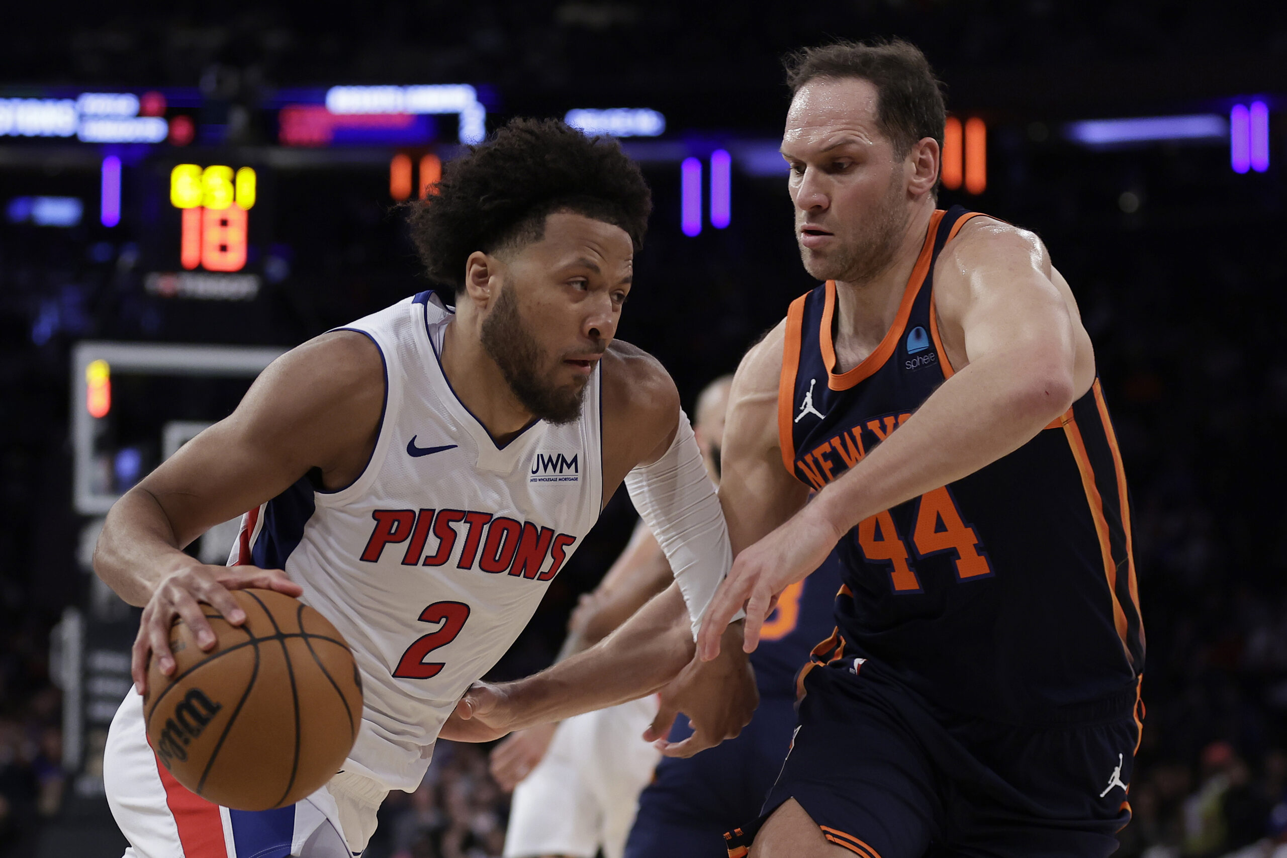 Detroit Pistons guard Cade Cunningham (2) drives against New York Knicks forward Bojan Bogdanovic during the first half of an NBA basketball game Monday, Feb. 26, 2024, in New York. (AP Photo/Adam Hunger)
