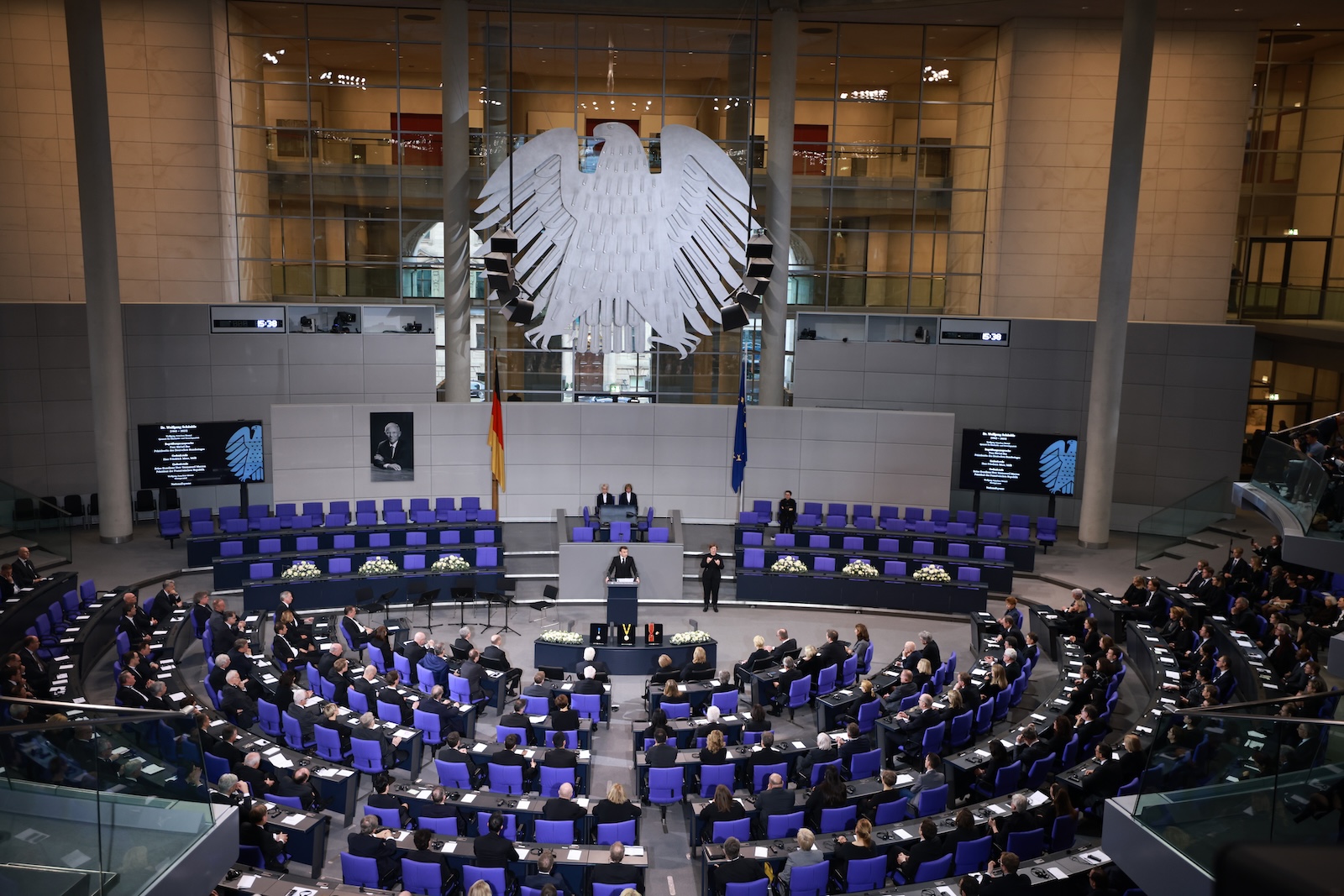 epa11096489 France's President Emmanuel Macron (C) delivers a speech during an act of mourning for deceased former German Parliament 'Bundestag' president Wolfgang Schaeuble at the German parliament 'Bundestag' in Berlin, Germany, 22 January 2024. Former German Parliament 'Bundestag' president and Christian Democratic Union CDU party and faction leader Wolfgang Schaeuble died at the age of 81 on 26 December 2023.  EPA/CLEMENS BILAN