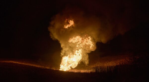 epa11097726 A fire after a rocket hit a gas pipeline on the outskirts of Kharkiv, northeastern Ukraine, 23 January 2024, amid the Russian invasion. At least two persons were killed and four others were injured after a Russian missile strike hit a residential building in Kharkiv overnight, the head of the Kharkiv Regional Military Administration, Oleh Syniehubov wrote on telegram. Russian forces launched air strikes targeting Kiev and Kharkiv on 23 January, Ukrainian authorities said.  EPA/SERGEY KOZLOV