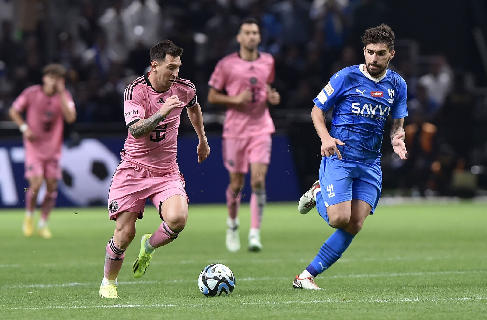 epa11113055 Lionel Messi (L) of Inter Miami in action against Ruben Neves of Al Hilal during the Riyadh Season Cup 2024 match between Al Hilal and Inter Miami in Riyadh, Saudi Arabia, 29 January 2024.  EPA/STR